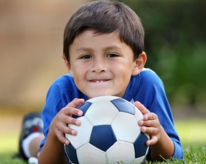 boy playing soccer