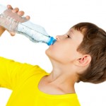 boy drinking bottle of water
