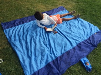 The Parasheet can easily fit 3 lounging children--and my 8 year old son is tall for his age.