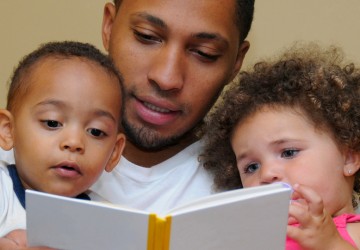 Dad reading to kids