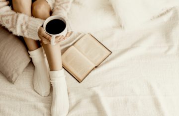 reading in bed with coffee