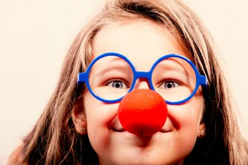 girl in red clown nose