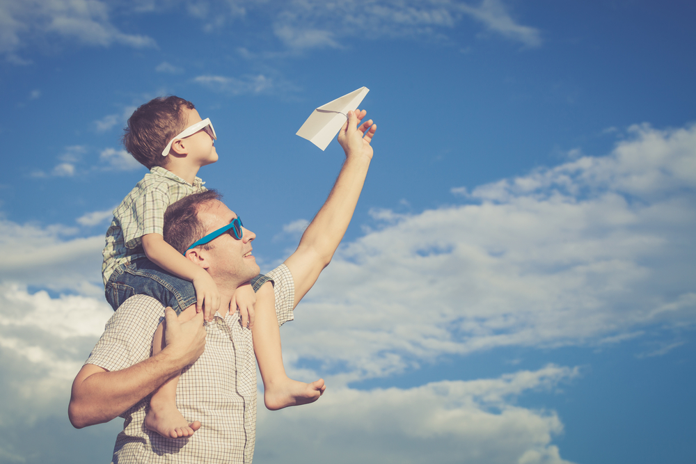 Dad & Son flying airplane