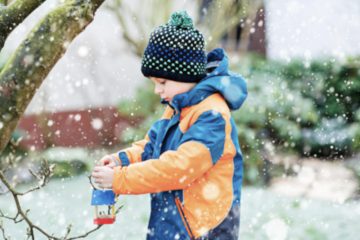 little boy snow birdhouse