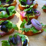 grilled bread, arugula, goat cheese, olives, onions, appetizer